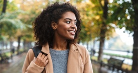 African american woman walking in a park